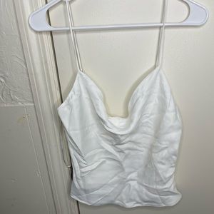 Zara white silk blouse buttons on the back . Size large .